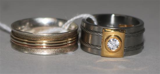 A French Acier et Or 750 (steel and 18ct gold) dress ring set cubic zirconia and a similar ring with three-colour gold banding